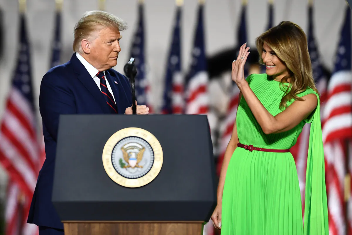 President Donald Trump (L) arrives with wife First Lady Melania Trump to deliver his acceptance speech for the Republican Party nomination for reelection during the final day of the Republican National Convention from the South Lawn of the White House on August 27, 2020 in Washington, DC. (Brendan Smialowski / AFP) (Photo by BRENDAN SMIALOWSKI/AFP via Getty Images)