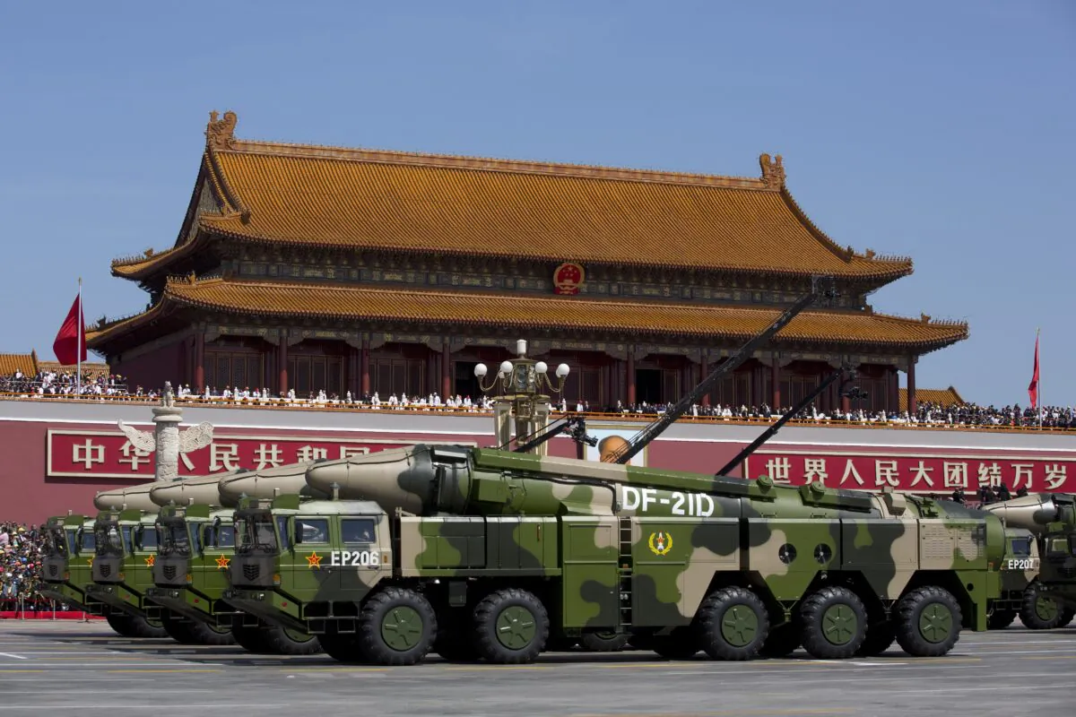 Chinese military vehicles, carrying DF-21D anti-ship ballistic missiles, drive past Tiananmen Square during a military parade in Beijing on Sept. 3, 2015. (Andy Wong/Pool/Getty Images)