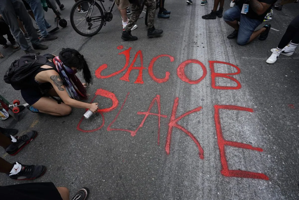 Demonstrators march through New York City to protest against the shooting of Jacob Blake, on Aug. 24, 2020. (Timothy A. Clary/AFP via Getty Images)
