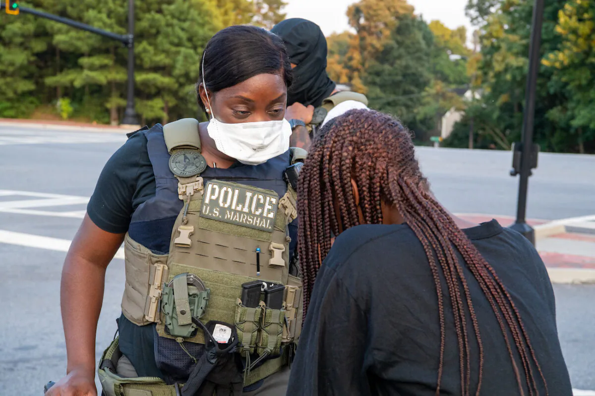 Photo shows a law enforcement officer from the U.S. Marshals in August 2020 in Georgia, who is involved in a missing child mission called "Operation Not Forgotten." (Shane T. McCoy/US Marshals/CC by 2.0)