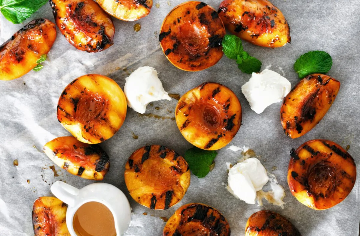 Finish off a late summer meal with grilled peaches, thrown on the last embers of summer. (KucherAV/Shutterstock)