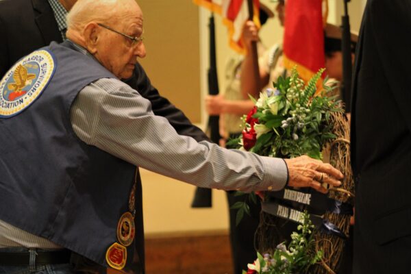 verteran honoring the memory of those fallen during WWII