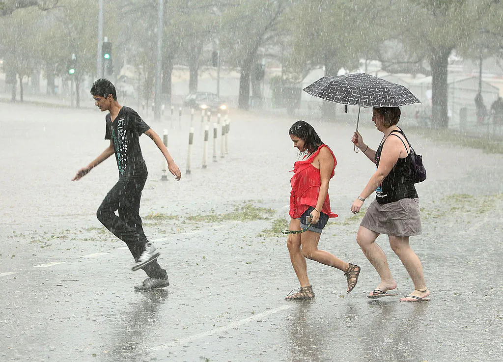 Pedestrians look to get out of heavy rain as Batman Avenue is flooded as massive storms hit Melbourne city on March 6, 2010 in Melbourne, Australia.(Robert Cianflone/Getty Images)