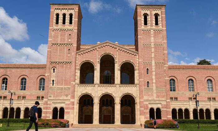 A student walks toward Royce Hall on the campus of University of California at Los Angeles (UCLA) in Los Angeles, Calif., on March 11, 2020. (Robyn Beck/AFP via Getty Images)