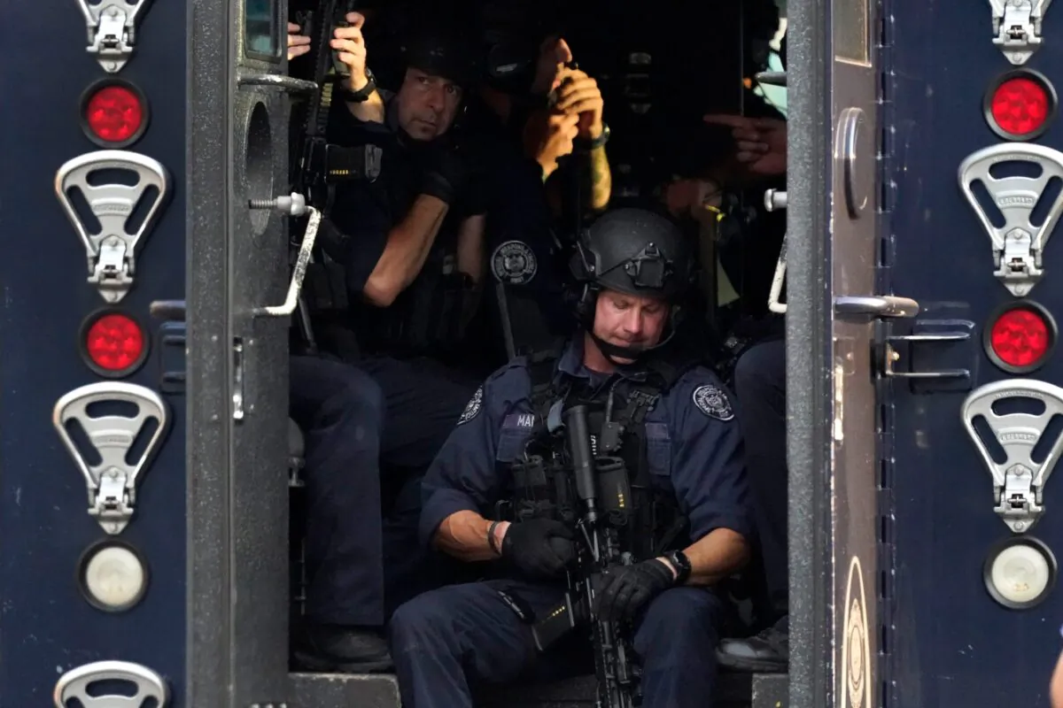 Members of the St. Louis Police Department SWAT team stage near the scene of a shooting in St. Louis., on Aug. 29, 2020. (Jeff Roberson/AP Photo)
