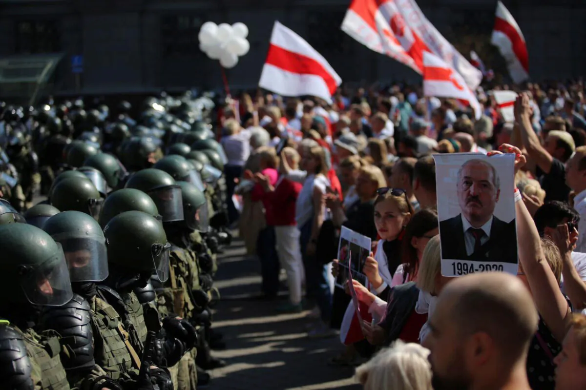 Law enforcement officers block a street during a rally of opposition supporters protesting against presidential election results in Minsk on Aug. 30, 2020. (Tut.By via Reuters)