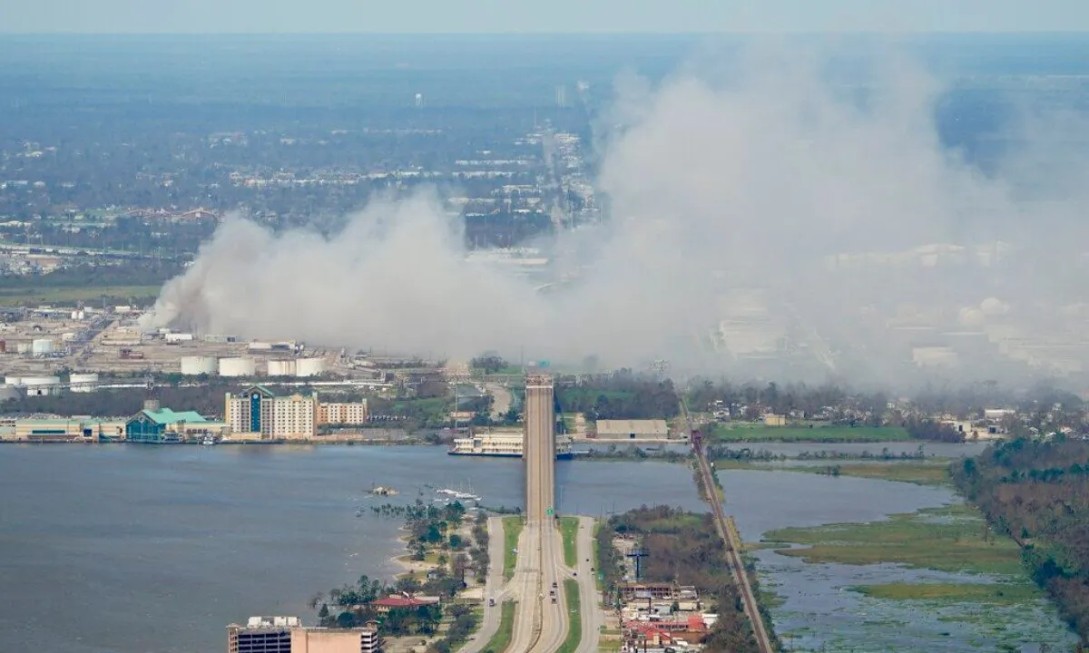 A chemical fire burns at a facility during the aftermath of Hurricane Laura, on Aug. 27, 2020, near Lake Charles, La. (AP Photo/David J. Phillip) 