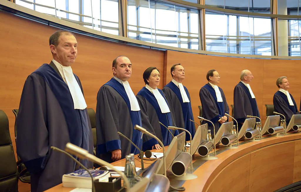The judges of the International Tribunal for the Law of the Sea (ITLOS), stand in the courtroom in Hamburg on Nov. 22, 2013. (Patrick Lux/AFP via Getty Images)