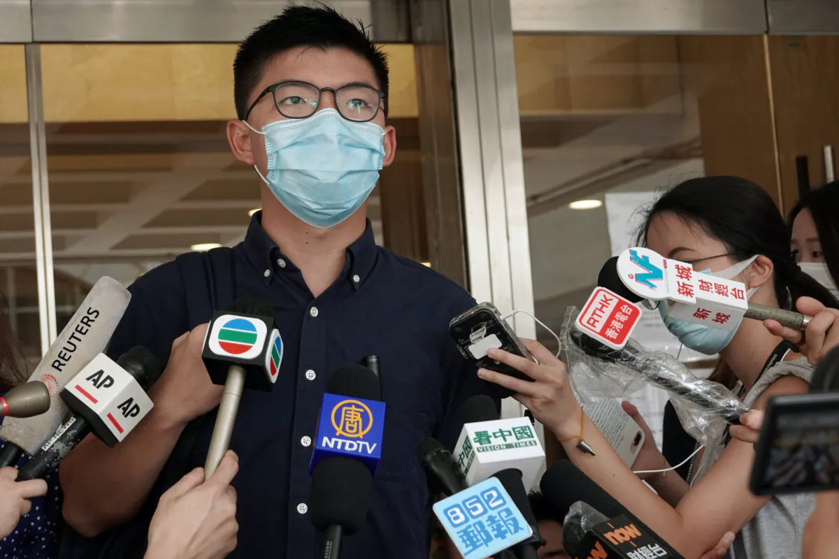 Pro-democracy activist Joshua Wong speaks to the media as he arrives at the High Court to lodge a judicial review over his disqualification from the 2019 district council elections, in Hong Kong on Aug. 7, 2020. (Joyce Zhou/Reuters)