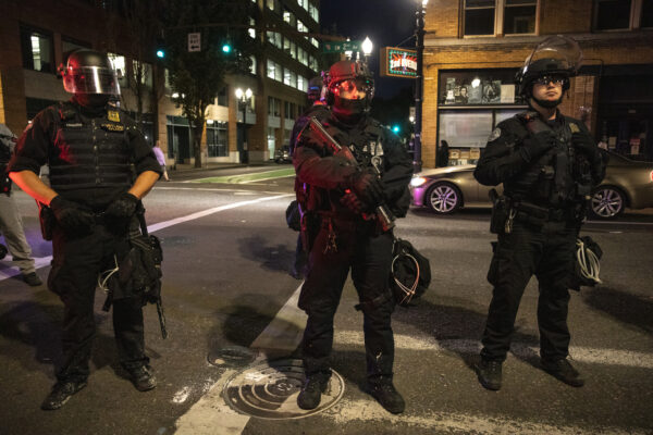 Portland police stand guard