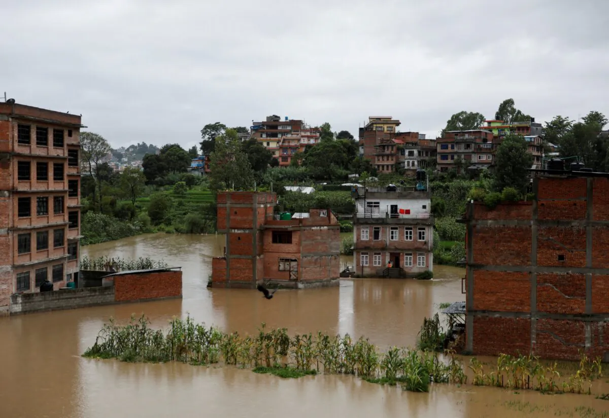 Houses are seen submerged in the waters as a river overflows due to incessant rainfall in Bhaktapur, Nepal, on July 20, 2020. (Navesh Chitrakar/Reuters)