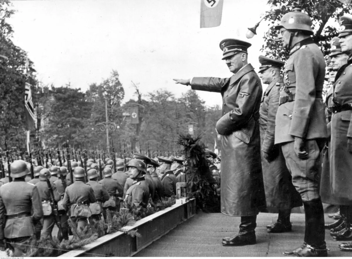 A month after the invasion of Poland that began the Second World War German troops parade in front of Adolf Hitler and Nazi generals in Warsaw, Poland, on Oct. 5, 1939. (Public Domain)