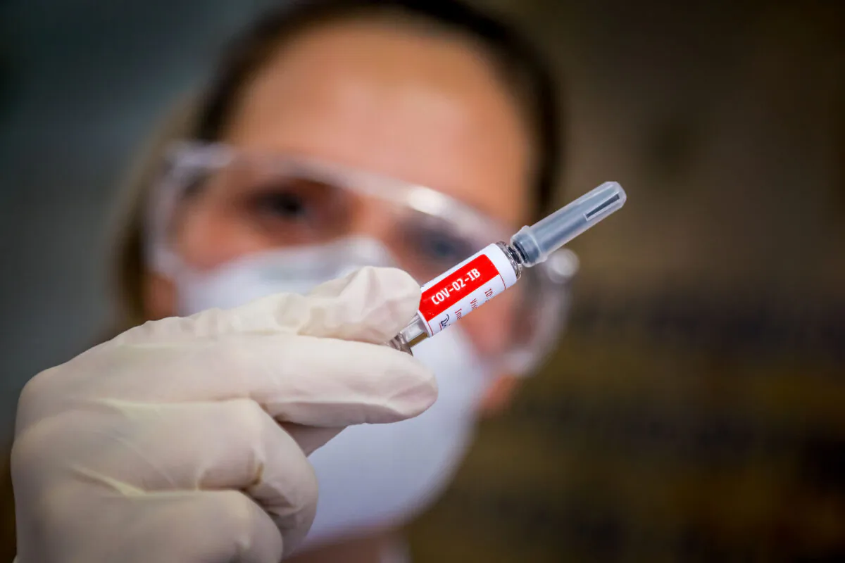 A nurse shows a COVID-19 vaccine produced by Chinese company Sinovac Biotech at the Sao Lucas Hospital in Porto Alegre, Brazil, on Aug. 8, 2020. (Silvio Avila/AFP via Getty Images)