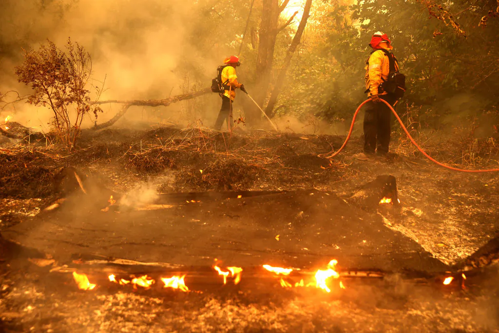 Firefighters extinguish spot fires in Fairfield, Calif., on Aug. 19, 2020. (Justin Sullivan/Getty Images)