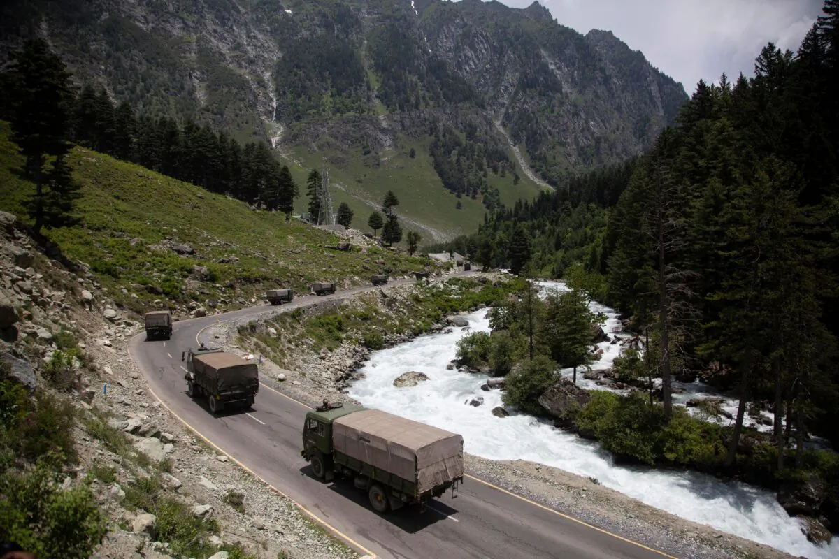 An Indian army convoy moves on the Srinagar-Ladakh highway at Gagangeer, north-east of Srinagar, India, on June 17, 2020. (Mukhtar Khan/AP Photo)