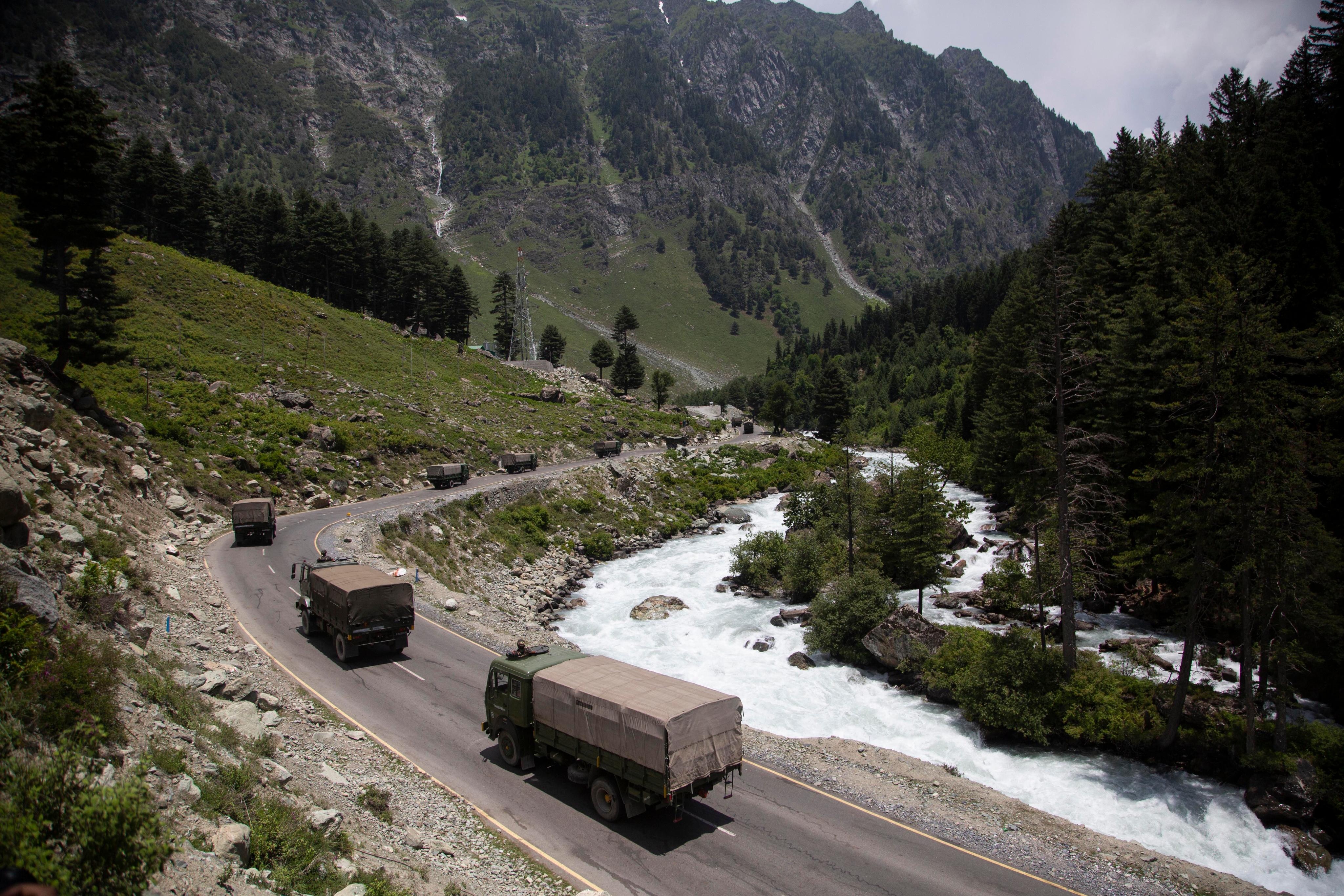 An Indian army convoy moves on the Srinagar-Ladakh highway