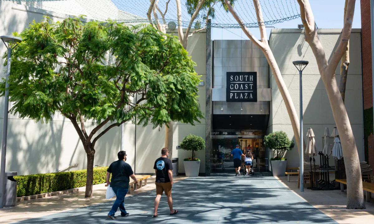 Customers enter the South Coast Plaza shopping mall on the first day of reopening following a shutdown due to the COVID-19 pandemic in Costa Mesa, Calif., on Aug. 31, 2020. (John Fredricks/The Epoch Times)