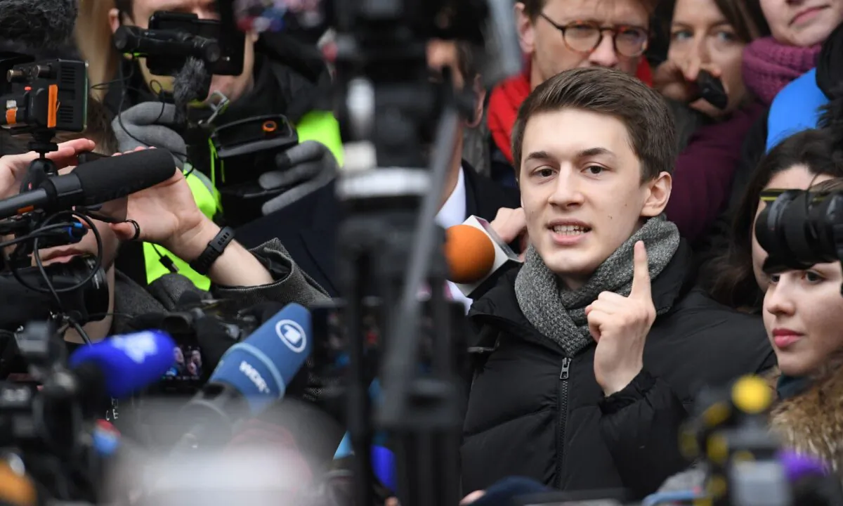 Russian student and blogger Yegor Zhukov reacts outside Moscow's Kuntsevsky district court after getting his suspended sentence, in Moscow, on Dec. 6, 2019. (Kirill Kudryavtsev/AFP via Getty Images)