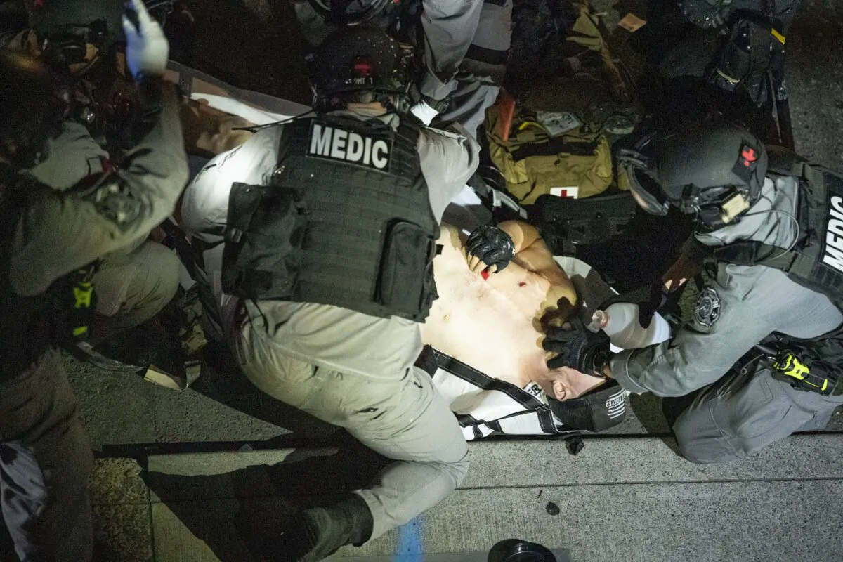 Aaron "Jay" Danielson shot in Portland, Ore., is treated on Aug. 29, 2020. He later died. (Nathan Howard/Getty Images)