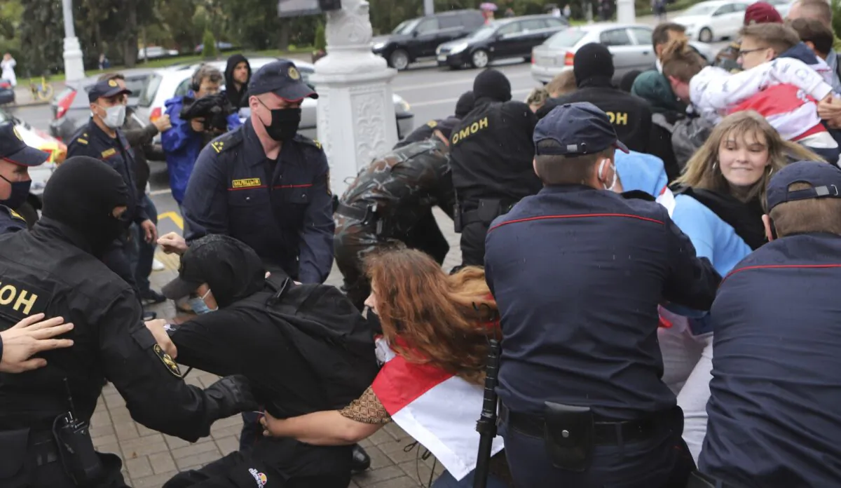 Police detain students during a protest against presidential election results in Minsk, Belarus, on Sept. 1, 2020. (AP Photo)