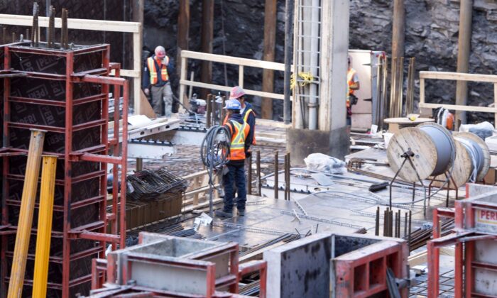 Men work at a construction site in Montreal in a file photo. (The Canadian Press/Paul Chiasson)