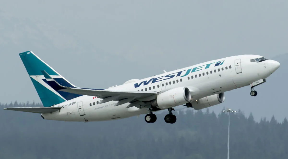 A WestJet aircraft taking off from Vancouver International Airport in Richmond, B.C., on May 13, 2019. (Jonathan Hayward/The Canadian Press)