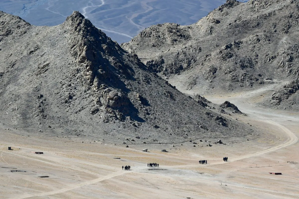 Indian soldiers walk at the foothills of a mountain range near Leh on June 23, 2020. - India's Prime Minister Narendra Modi said on June 19 that his country was "hurt and angry" after a border clash with China that left 20 troops dead, and warned that the army has been given free reign to respond to any new violence. (TAUSEEF MUSTAFA/AFP via Getty Images)