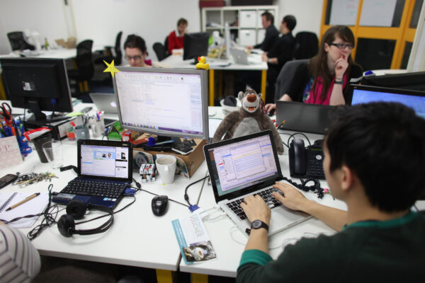 People work at computers in TechHub, a busy office space for technology start-up in London on March 15, 2011.