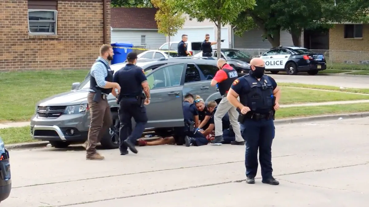 In this screen grab obtained from a social media video, Jacob Blake lies on the street after he got shot by a police officer after resisting arrest in Kenosha, Wisc., on Aug. 23, 2020. (Incident Response/via Rreuters)