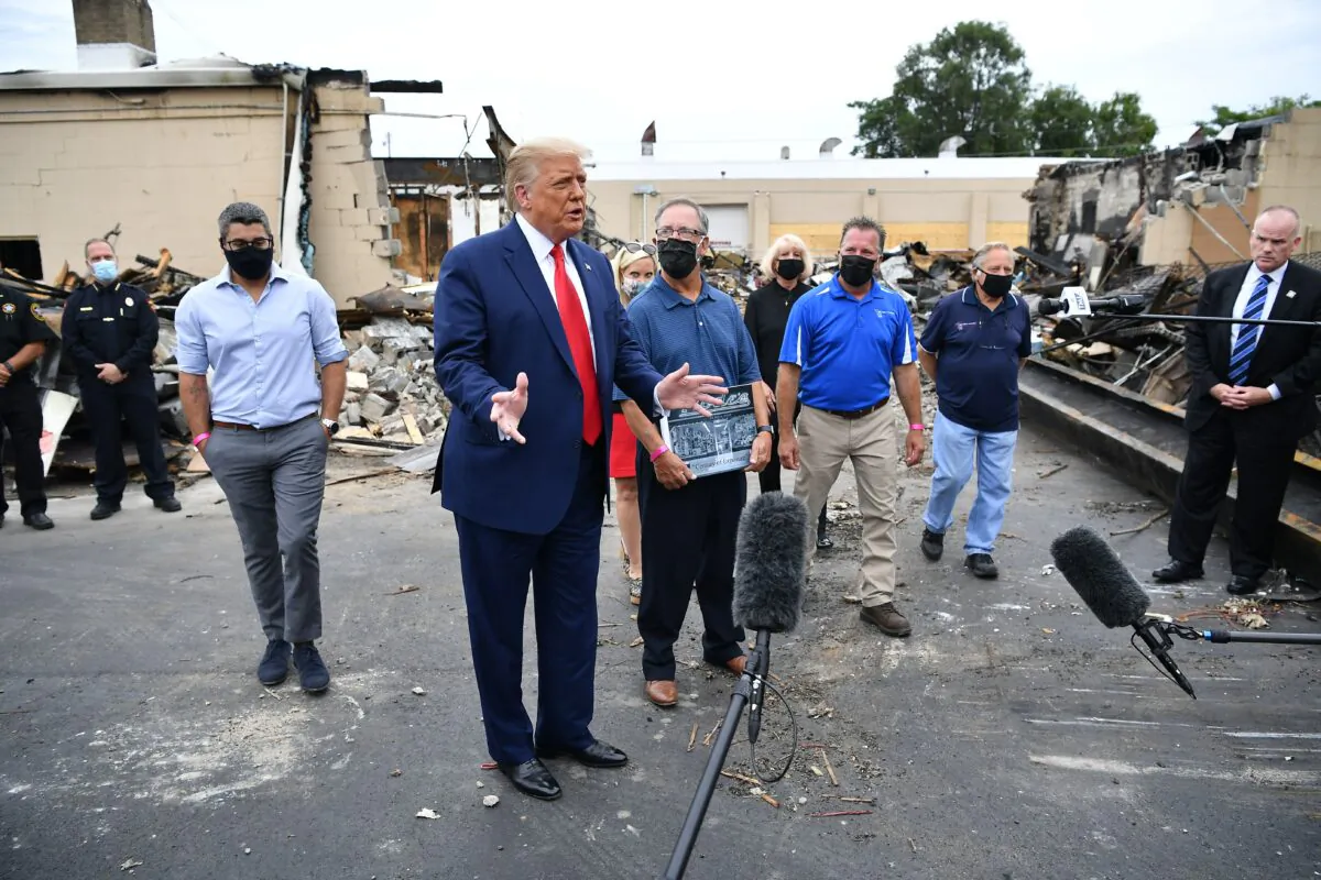 President Donald Trump views property damaged during riots in Kenosha, Wis., on Sept. 1, 2020. (Mandel Ngan/AFP via Getty Images)