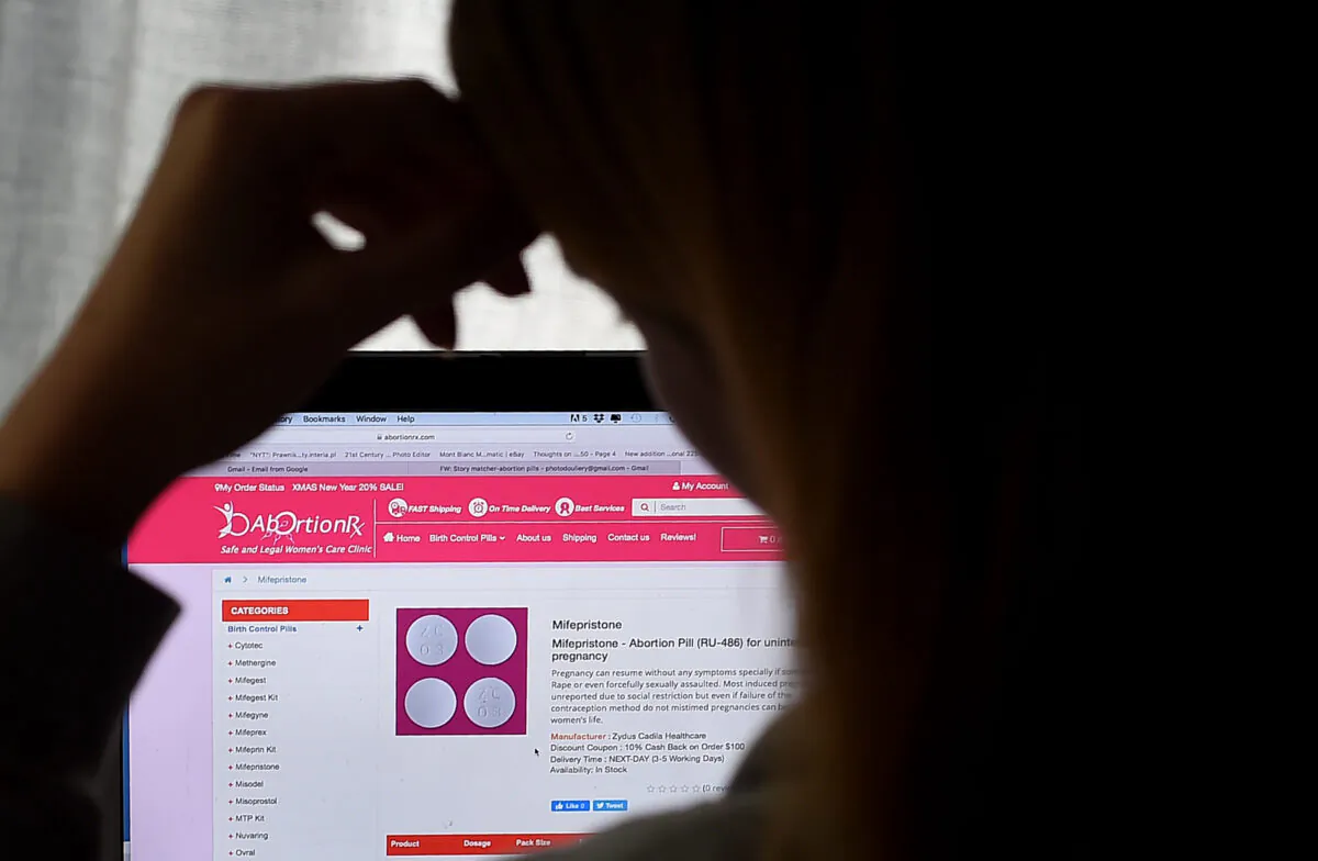 A woman looks at an abortion pill (RU-486) displayed on a computer in Arlington, Va., on May 8, 2020. (Olivier Douliery/AFP via Getty Images)
