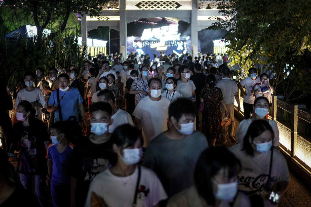 Long queues at hospitals, apartment lockdowns in wuhan as some suspect virus resurgence
