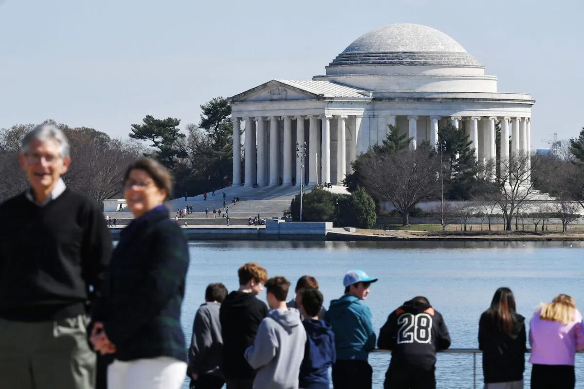 Tourists are seen at the Tidal Basin across from the Thomas Jefferson Memorial in Washington, on March 19, 2019. (Mandel Ngan/AFP via Getty Images)