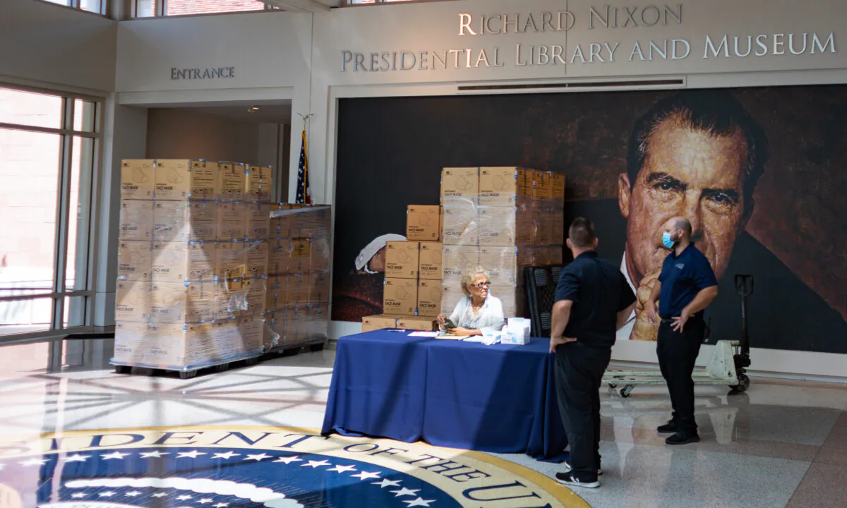 Representatives of the Richard Nixon Foundation prepare to distribute 700,000 protective face masks to Orange County communities in Yorba Linda, Calif., on Sept. 1, 2020. (John Fredricks/The Epoch Times)