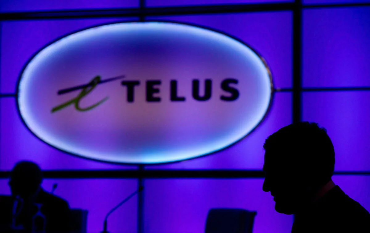 A Telus sign is pictured at company's annual meeting in Vancouver, Canada, on May 8, 2014. (Darryl Dyck/The Canadian Press)