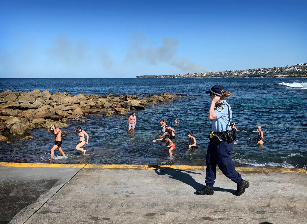 Swimmers are ordered from the water by Police at Clovelly Beach on April 24, 2020 in Sydney, Australia. (Ryan Pierse/Getty Images)