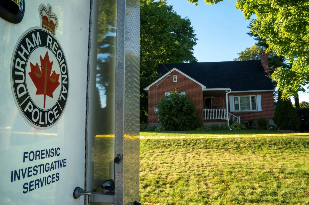 A Durham Police forensics truck sits in front of a home on Parklane Avenue in Oshawa, Ont., on September 4, 2020. (The Canadian Press/Frank Gunn)