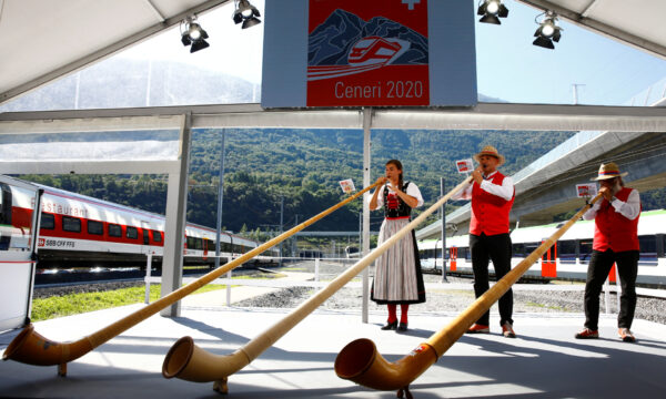 Alphorn blowers perform during the opening ceremony of the newly built Ceneri Base Tunnel