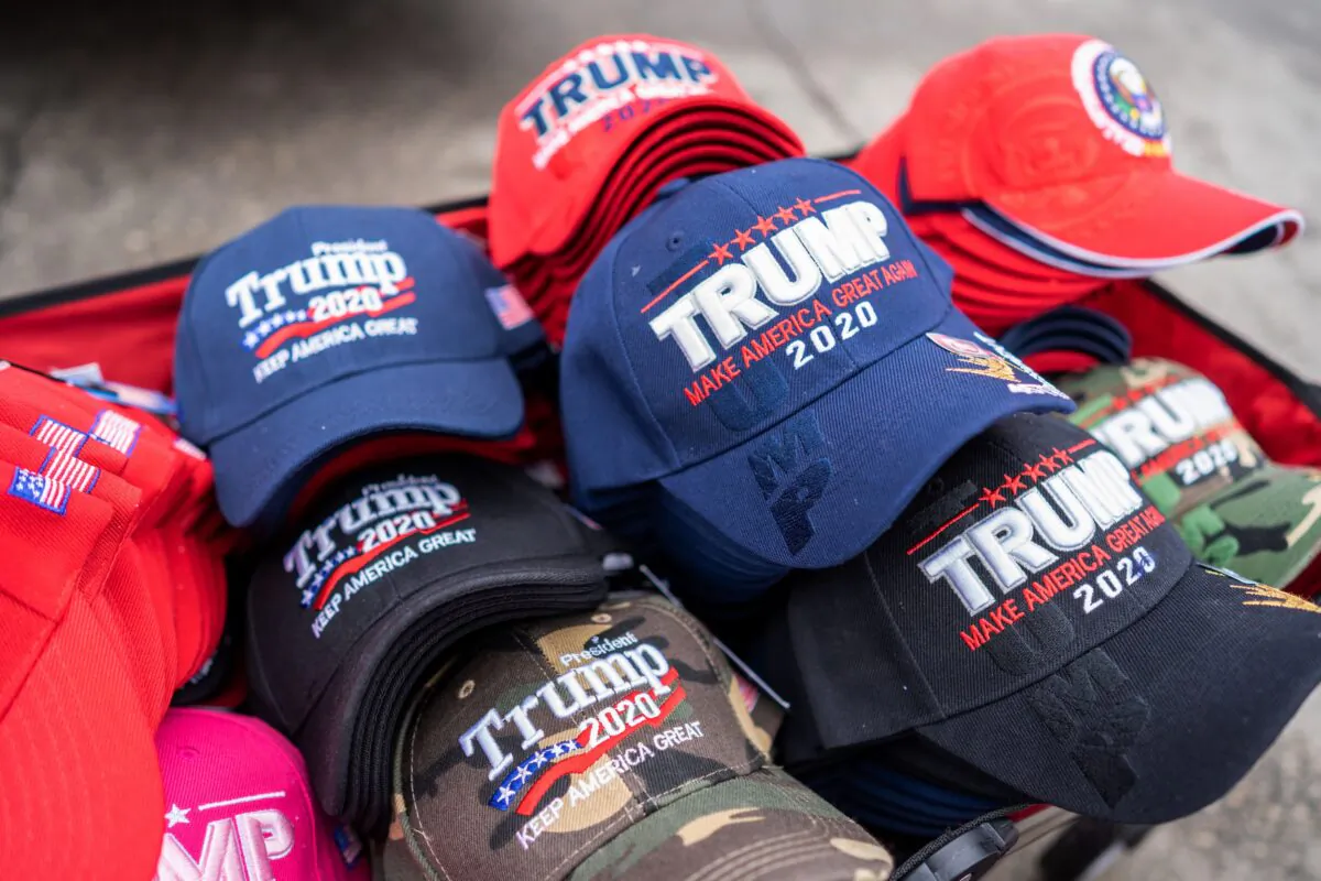 Hats to sell to supporters of US President Donald Trump are pictured outside Knapp Arena where he will later hold a campaign rally in Des Moines, Iowa on January 30, 2020. (Photo by Kerem Yucel / AFP) (Photo by KEREM YUCEL/AFP via Getty Images)