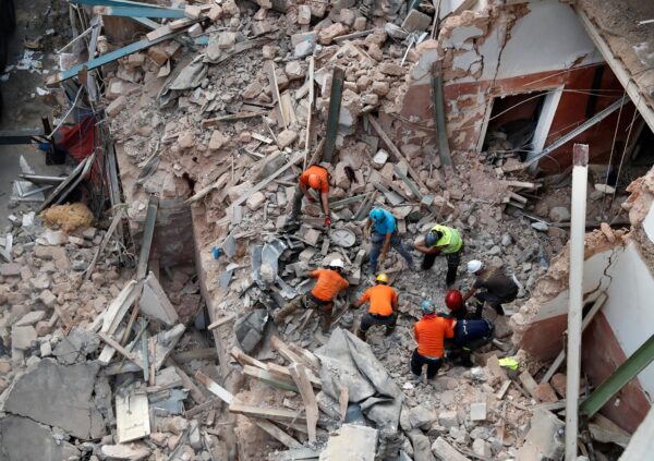 Rescue workers in the rubble