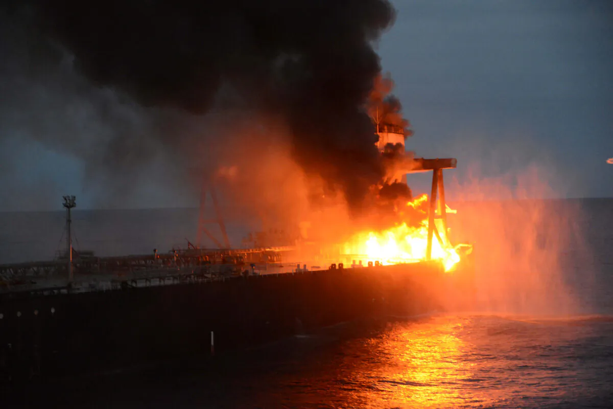 The New Diamond, a very large crude carrier (VLCC) chartered by Indian Oil Corp (IOC), that was carrying the equivalent of about 2 million barrels of oil, is seen after a fire broke out off east coast of Sri Lanka, on Sept. 4, 2020. (Courtesy Sri Lankan Airforce media/Handout via Reuters)