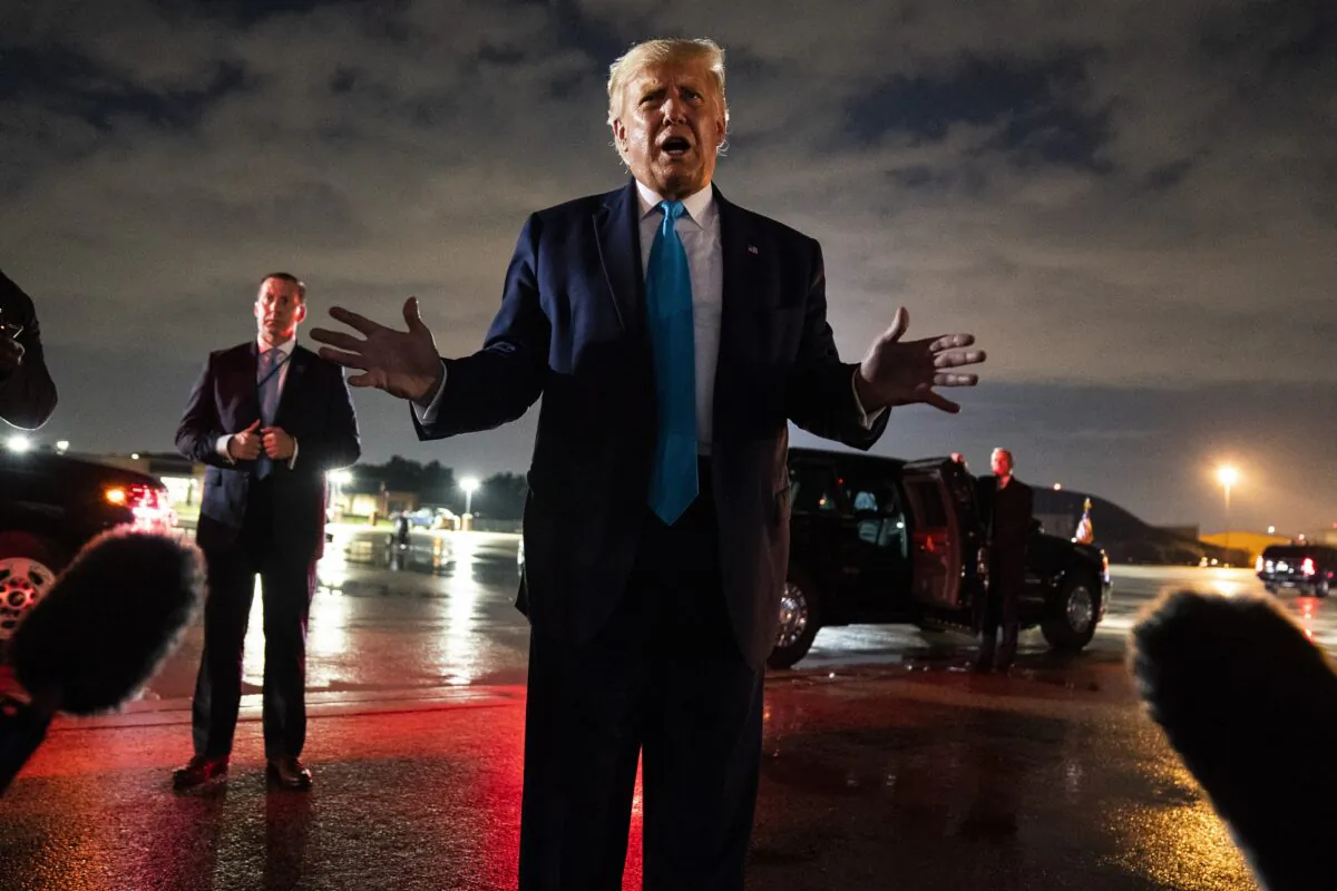 President Donald Trump talks with reporters at Andrews Air Force Base after attending a campaign rally in Latrobe, Pa., at Andrews Air Force Base, Md., on Sept. 3, 2020. (Evan Vucci/AP Photo)