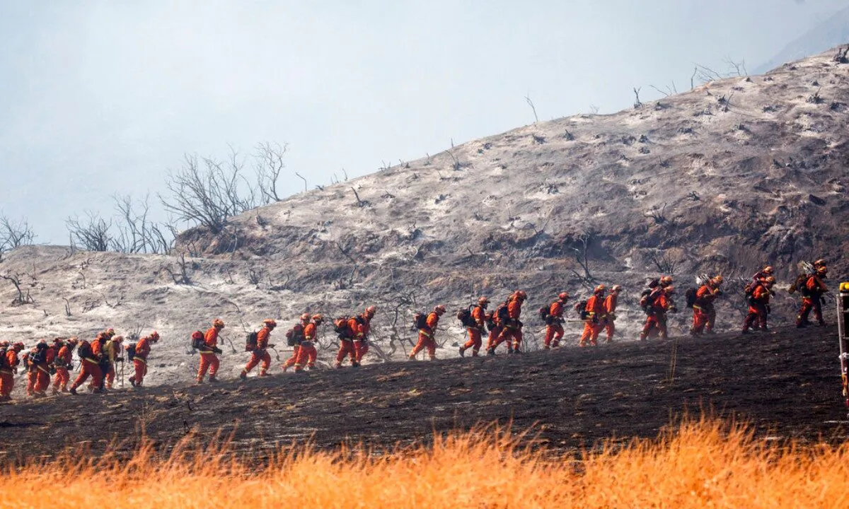 An air tanker drops retardant as a wildfire burns at a hillside in Yucaipa, Calif., on Sept. 5, 2020. (Ringo H.W. Chiu/AP Photo)