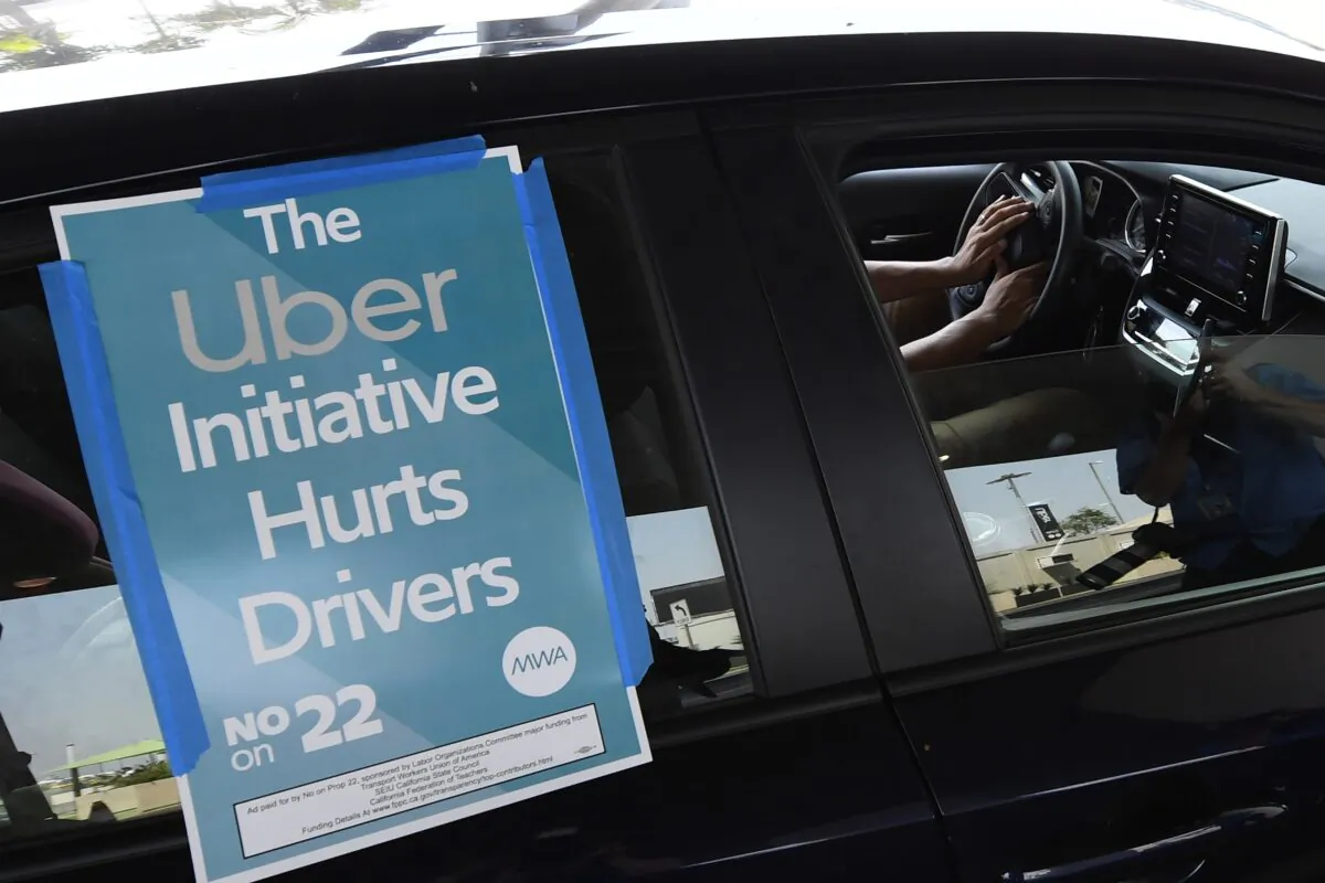 A ride share driver participates in a protest by drivers and their supporters at Los Angeles International Airport in Los Angeles, Calif. on Aug. 20, 2020. (Robyn Beck/AFP via Getty Images)