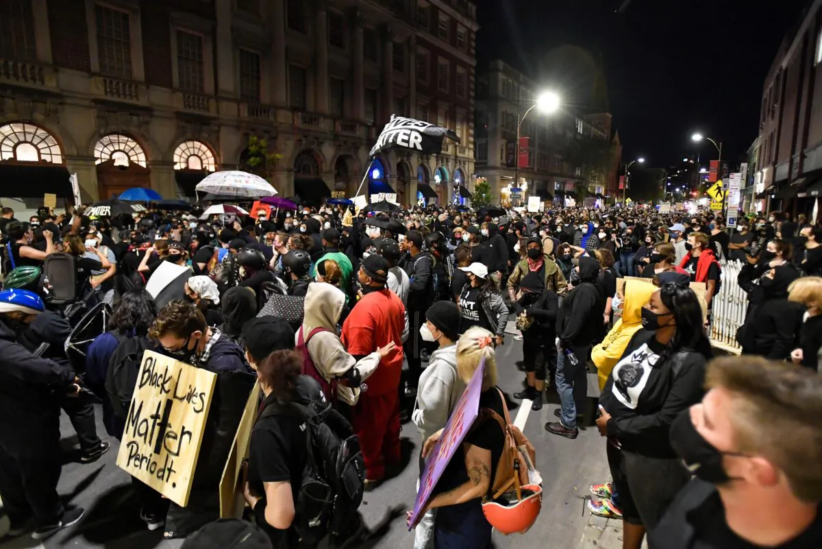 Demonstrators march through the streets protesting the death of Daniel Prude in Rochester, N.Y., on Friday, Sept. 4, 2020. (Adrian Kraus/AP Photo)
