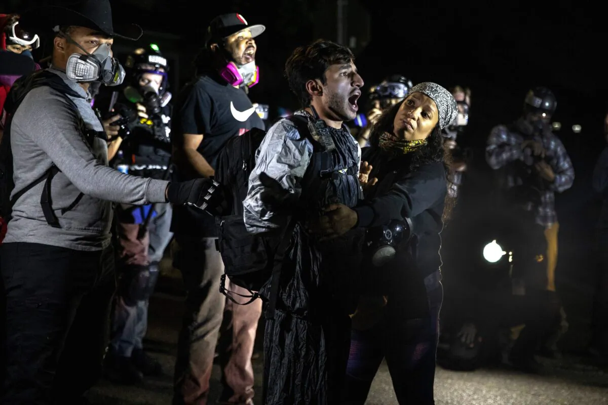A man screams at police during a Black Lives Matter march that turned into a riot, in Portland, Ore., Sept. 5, 2020. (Paula Bronstein/AP Photo)