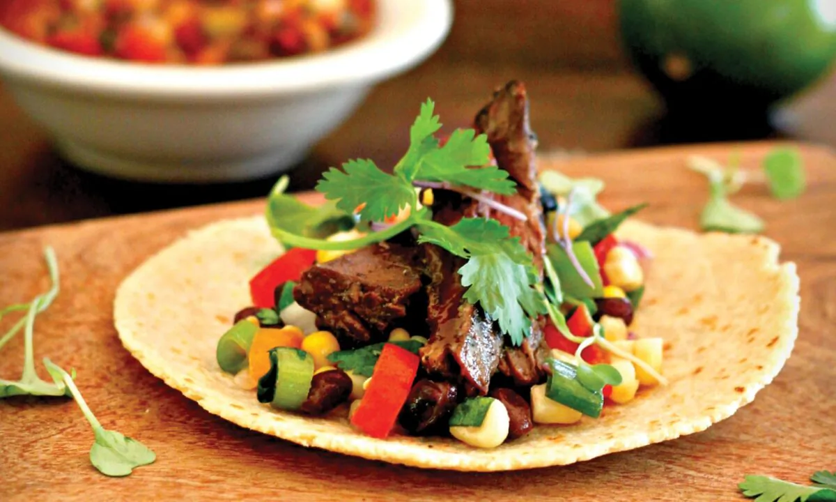 Grilled skirt steak and a fresh black bean and corn salsa in a warmed flour tortilla. (Lynda Balslev for TasteFood)