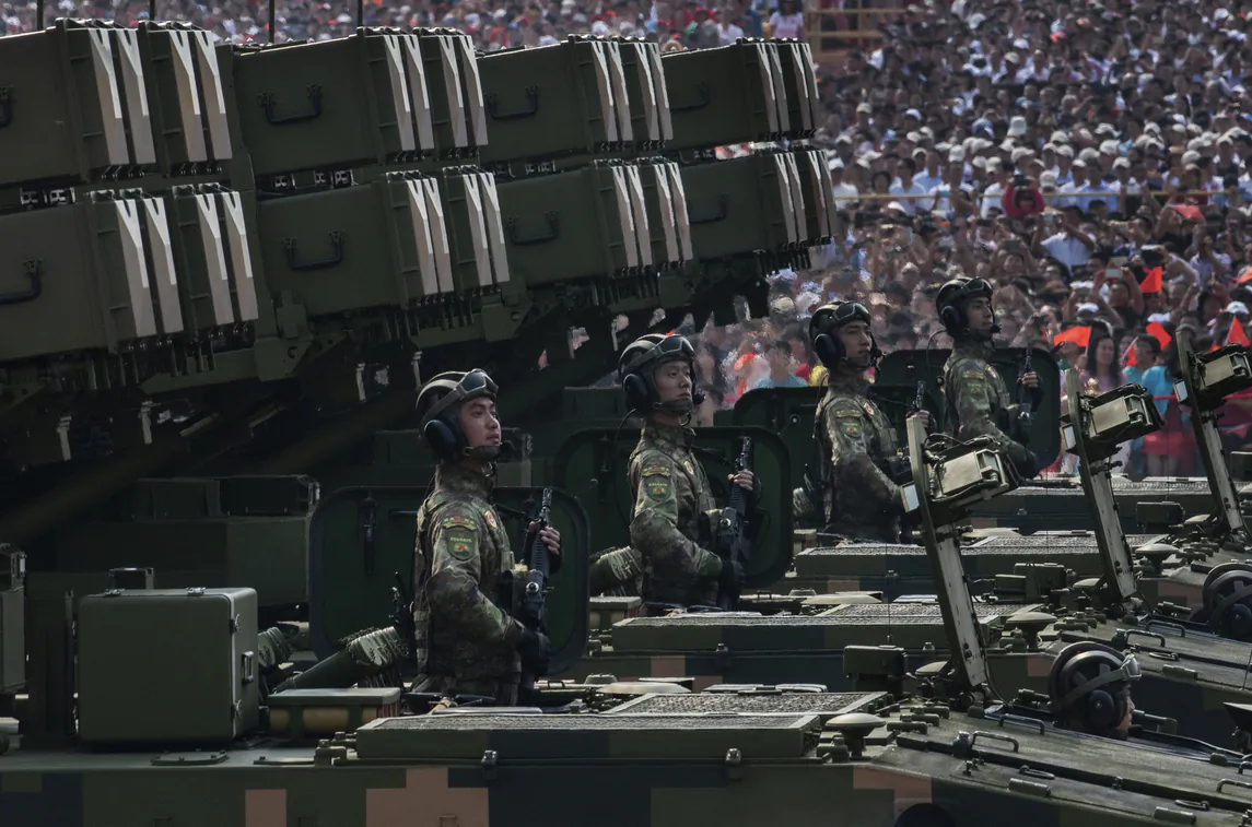 Chinese soldiers sit atop mobile rocket launchers as they drive in a parade to celebrate the 70th Anniversary of the founding of the People's Republic of China in 1949, at Tiananmen Square on October 1, 2019 in Beijing, China. (Kevin Frayer/Getty Images)