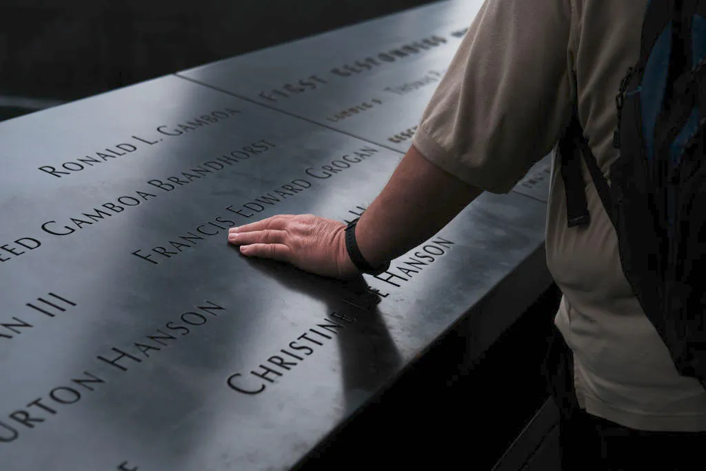 People walk on the grounds of the September 11 Memorial and Museum in New York City on Sept 5, 2019. (Spencer Platt/Getty Images)
