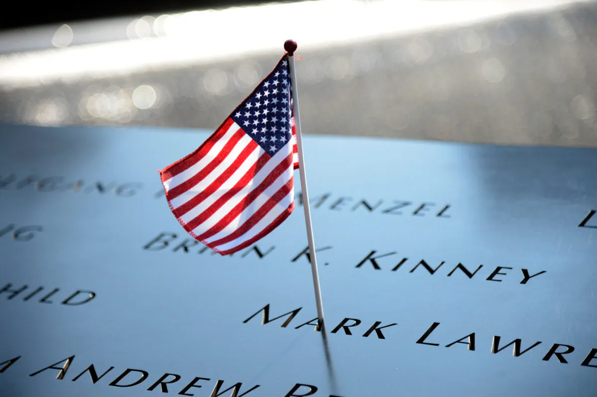 A flag adorns the 9/11 Memorial on the 12th anniversary of the terrorist attacks on lower Manhattan at the World Trade Center site in New York City on Sept. 11, 2013. (Kevin Mazur/Getty Images)